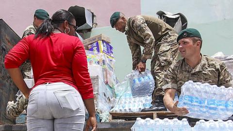 Soldiers giving out supplies in BVI