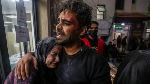 Victims of an Israeli army strike react outside of Kuwait hospital in Rafah in the southern Gaza Strip on December 28, 2023, as battles continue between Israel and the Palestinian Hamas movement.