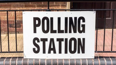 A sign for a polling station
