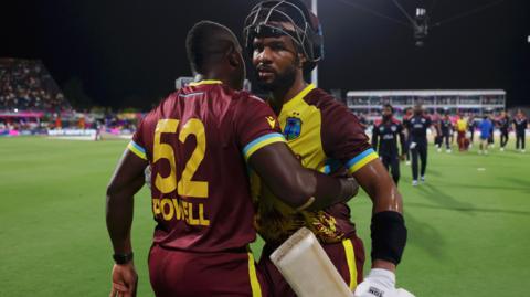 Shai Hope is congratulated by Rovman Powell after West Indies win