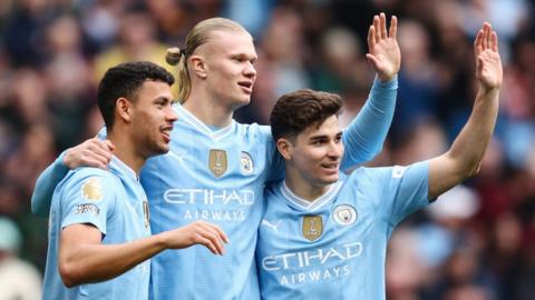 Matheus Nunes, Erling Haaland and Bernardo Silva of Manchester City celebrate a goal