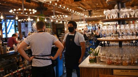 Bartenders wearing facemasks