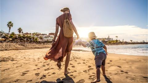 Family Tenerife holiday beach scene