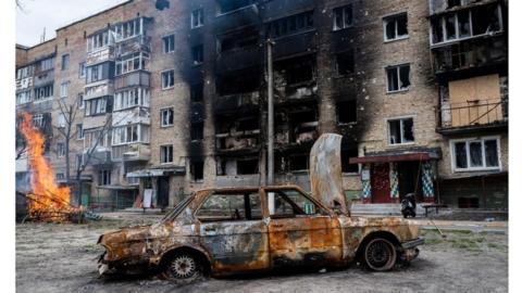 A destroyed car and building are seen, as Russia"s invasion of Ukraine continues, in Irpin, near Kyiv, Ukraine.