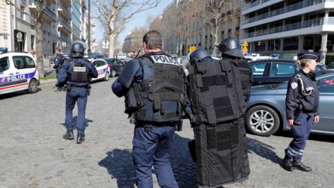 Police outside the International Monetary Fund (IMF) offices where an envelope exploded in Paris, France, 16 March