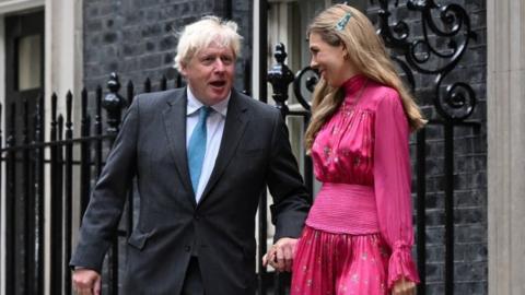 Outgoing British Prime Minister Boris Johnson and his wife Carrie Johnson