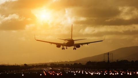 Airplane about to land on airport runway. Cape Town, South Africa