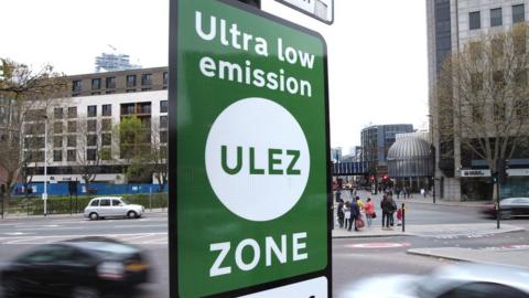 File photo showing green sign saying 'Ultra Low Emission Zone'.
