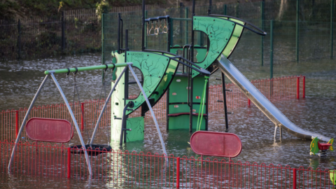 TAFF’S WELL, WALES - JANUARY 12: A flooded playground on January 12, 2022, in Taff’s Well, Wales. The Met Office has flood warnings and alerts in place for large parts of the UK for this week.There have been specific warnings for the South West, Oxfordshire and Wales in from Wednesday evening until Thursday afternoon. (Photo by Matthew Horwood/Getty Images)