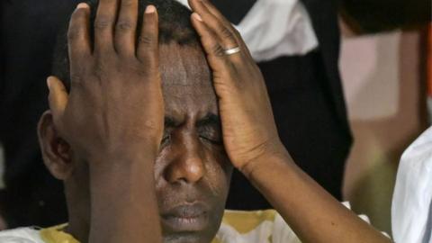 Biram Dah Abeid holding his hands to his head