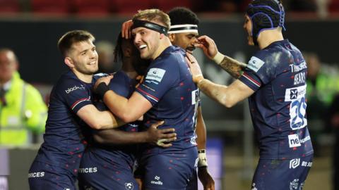 Bristol players celebrate a try