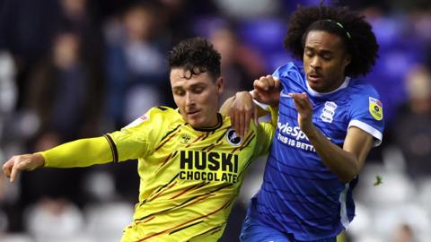 Millwall's Danny McNamara challenges for the ball with Tahith Chong of Birmingham City