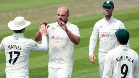 Worcestershire players celebrate taking a wicket