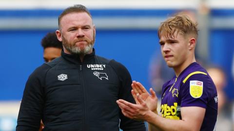 Derby County boss Wayne Rooney looks on