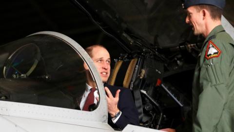 Prince William in the cockpit of a Eurofighter Typhoon jet during a visit to RAF Coningsby