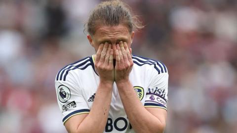 Luke Ayling looks distraught after Leeds lose at West Ham