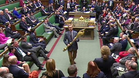Lloyd Russell-Moyle carries the mace through the Commons chamber