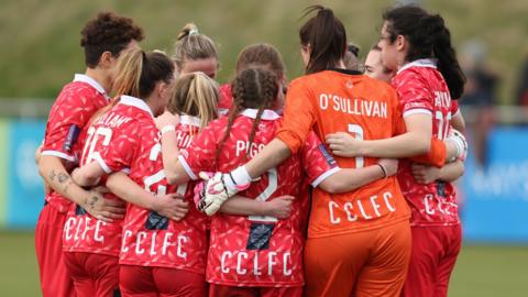 Cardiff City Ladies players in a huddle before a game