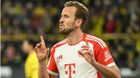 Harry Kane celebrates scoring for Bayern Munich against Borussia Dortmund