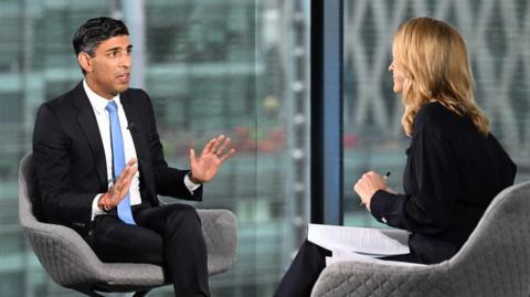 Rishi Sunak talking to Laura Kuenssberg