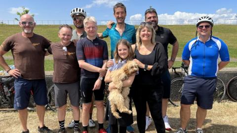 Rob Walker, Paul Hawkins, Paul's daughter Imo, their dog Max and others on the bike ride