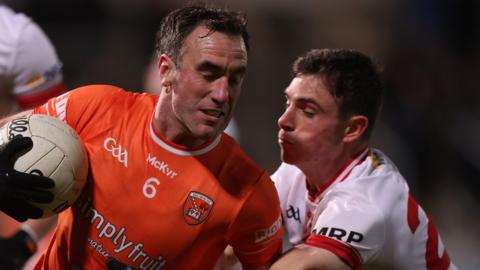 Tyrone's David Mulgrew challenges Armagh's Niall Rowland at the Athletic Grounds