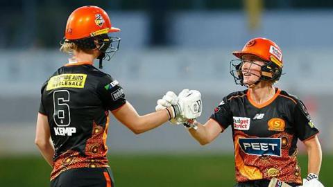 Beth Mooney and Freya Kemp punch gloves