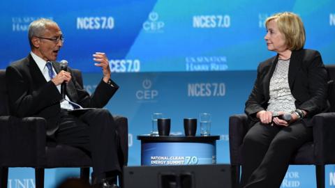 Counsellor to President Barack Obama John Podesta (left) and former Secretary of State Hillary Clinton speak at the National Clean Energy Summit 7.0 at the Mandalay Bay Convention Center on 4 September 2014 in Las Vegas, Nevada