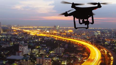 Drone flying above a city