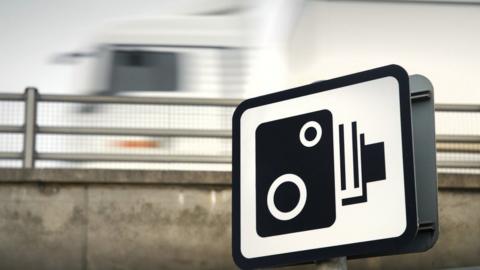A speed camera sign