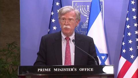 John Bolton addresses a press conference in Jerusalem