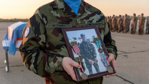 Handout photo issued by the Strategic Communications & Public Information Office of a UN solemn ceremony in Beirut for Pte Sean Rooney.