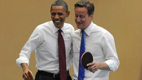 Barack Obama and David Cameron play table tennis in 2011