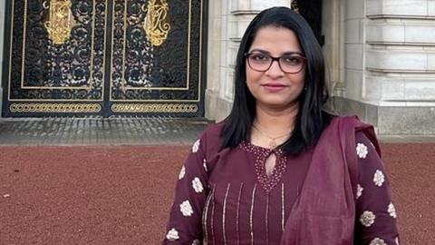 Deepa Pappu outside Buckingham Palace