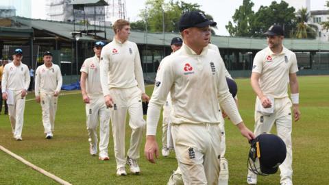 England players walk off after the tour is abandoned during a warm-up game