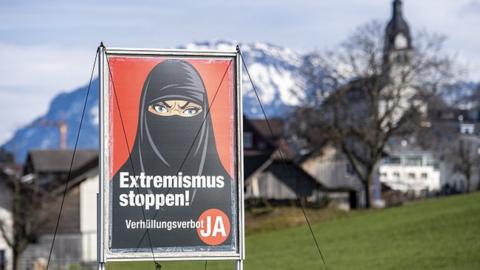 A poster promoting "Yes to the burka ban" is seen in Oberdorf, in the canton of Nidwalden, Switzerland, 16 February 2021