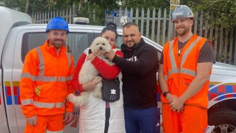 Mia with her owners and Network Rail staff