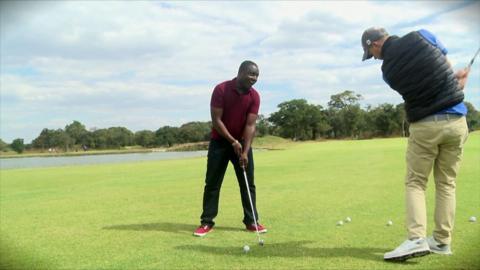 People playing golf in Zambia