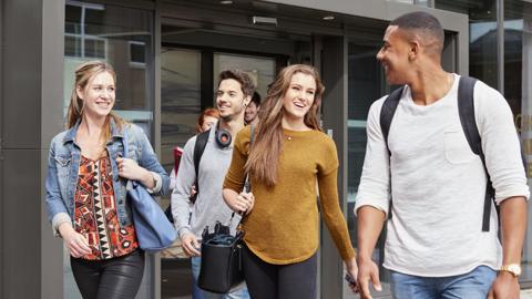 Students exit a building at Cardiff university