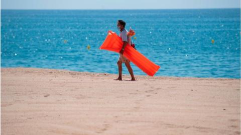 Man on beach in Spain