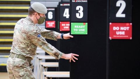 Members of the Royal Scots Dragoon Guard help set up a vaccination centre at the Ravenscraig Regional Sports Facility