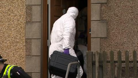 forensics officers at the house in Pentrechwyth Road, Swansea