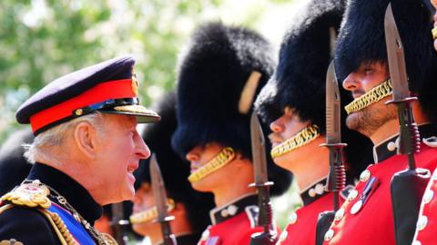 King Charles III inspects members of the Grenadier Guards during a ceremony to present the regiment with their new Colours at Buckingham Palace in London on Tuesday June 9, 2026