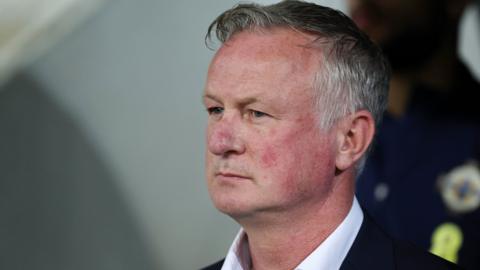 Michael O'Neill watches his Northern Ireland team go down to a 4-2 defeat in Slovenia