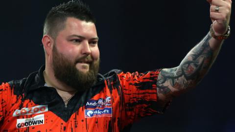 Michael Smith celebrates