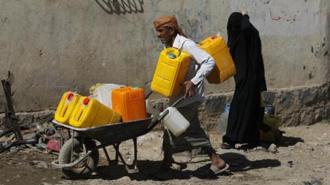 Yemenis wait to collect drinking water from a donated water pipe in Sanaa, Yemen, 18 November 2017