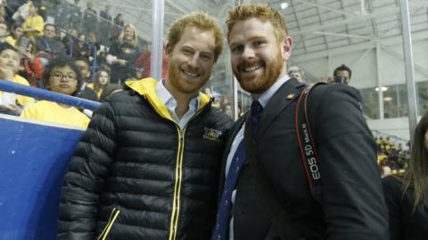 Prince Harry (R) and photgrapher Adam Scotti (L)