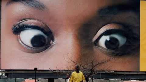 A billboard above a road in Nigera.