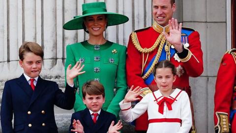 Princes Louis and George and Princess Charlotte wave to crowds