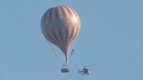 Hot-air balloon and helicopter